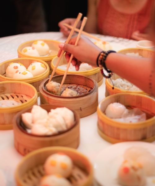 People sharing dumplings in Chinatown