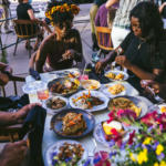 Friends dine on the patio at Virtue in Hyde Park